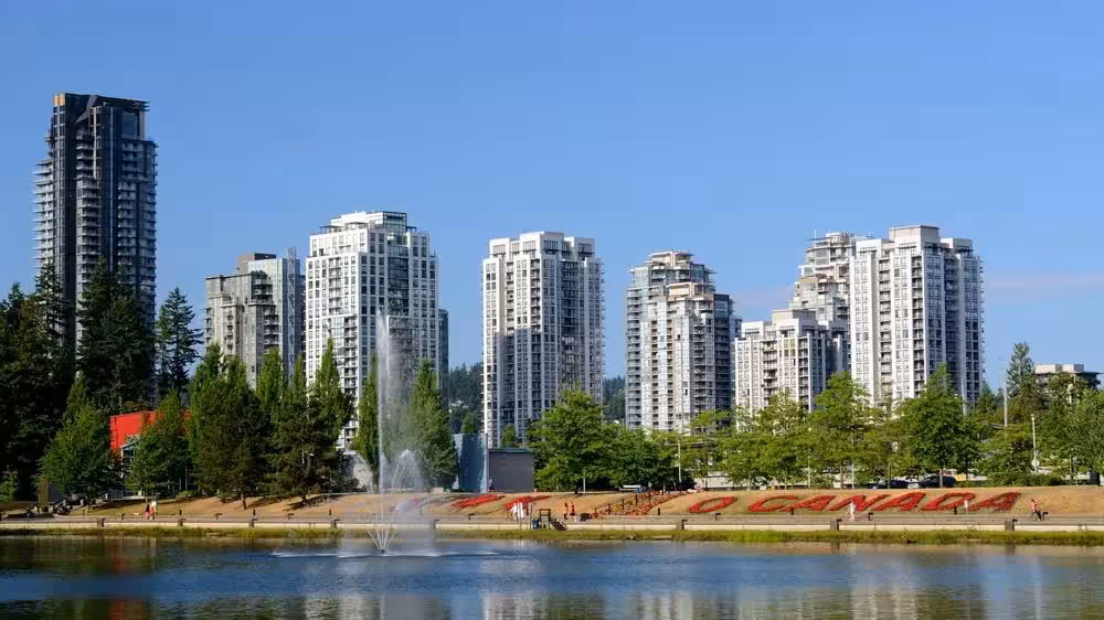 Coquitlam, BC with Lafarge Lake and Town Centre skyline